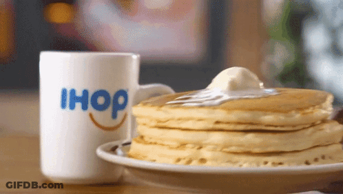 A Stack Of Pancakes Next To An Ihop Mug GIF