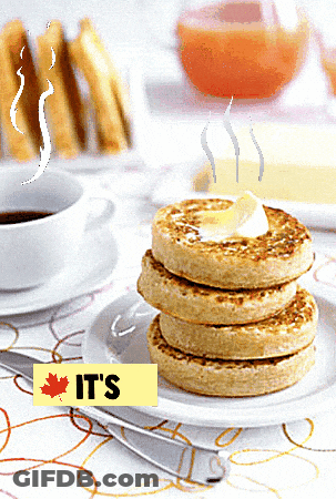 A Stack Of Pancakes With A Yellow Sign That Says It 'S On It GIF