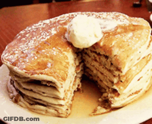 A Stack Of Pancakes With Butter And Syrup On A Plate GIF