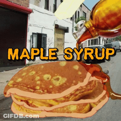 A Stack Of Pancakes With Maple Syrup Being Poured Over Them GIF