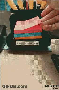 A Stack Of Sticky Notes Sits On A Desk With A Gifsboom.net Logo In The Corner GIF