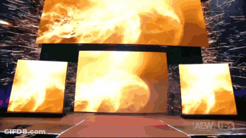 A Stage With A Large Screen That Says Aew On The Bottom GIF