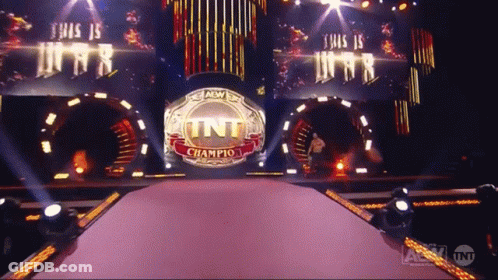 A Stage With A Tnt Champion Ring In The Center GIF