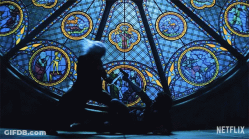 A Stained Glass Window With The Word Netflix On It GIF
