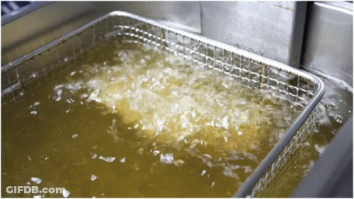 A Stainless Steel Fryer Is Filled With A Yellow Liquid GIF