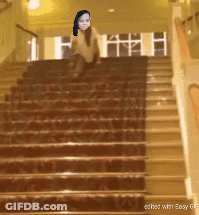 A Staircase With A Picture Of A Woman On It GIF