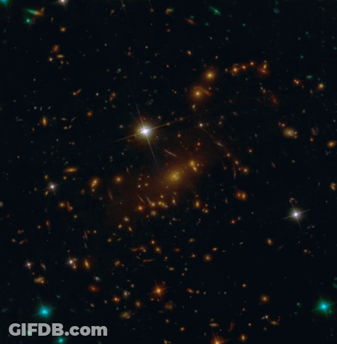 Star In Middle Of Galaxy In Night Sky GIF