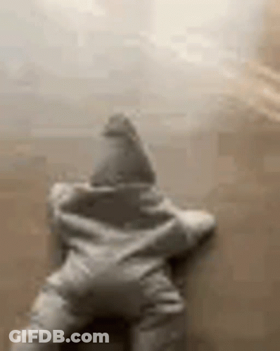 A Star Shaped Pillow Is Sitting On A Couch . GIF
