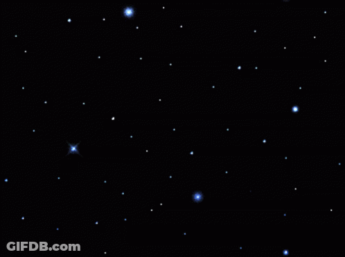 A Star Shines Brightly In A Dark Night Sky GIF