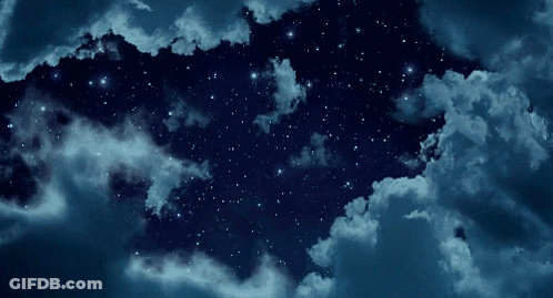 A Starry Night Sky With Clouds And Stars GIF