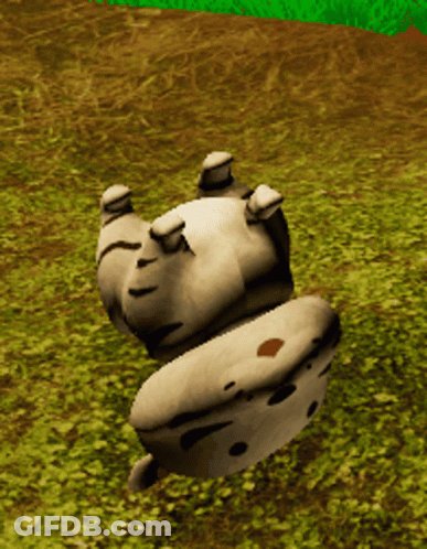 A Statue Of A Cow Is Laying On Its Back In A Grassy Field GIF