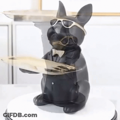 A Statue Of A Dog Wearing Sunglasses And A Suit Holding A Tray GIF