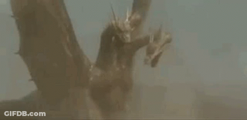 A Statue Of A Dragon With Three Heads And Wings Is Flying In The Air . GIF