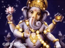 A Statue Of A Elephant Holding A Lotus Flower GIF