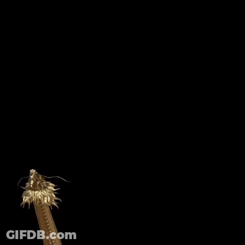A Statue Of A Gold Dragon With A Long Tail On A Black Background GIF