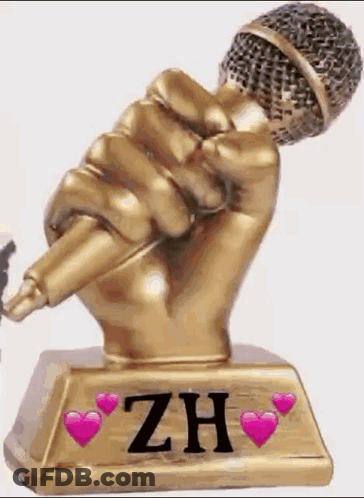 A Statue Of A Hand Holding A Microphone With The Name Zh On It GIF