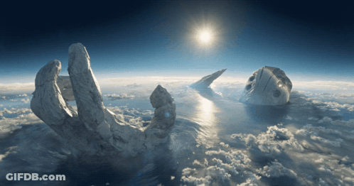 A Statue Of A Hand Reaching Into The Sky GIF