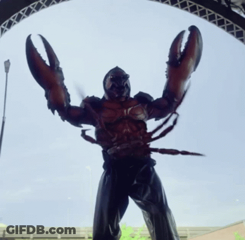 A Statue Of A Man Dressed As A Lobster With Huge Claws GIF