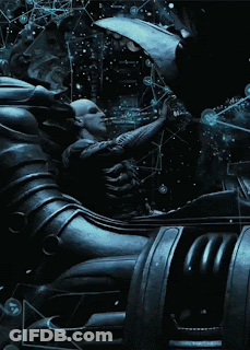 A Statue Of A Man In A Space Suit Is Surrounded By Bubbles And A Globe GIF