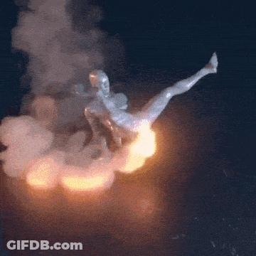 A Statue Of A Man Is Flying Through The Air With Smoke Behind Him GIF