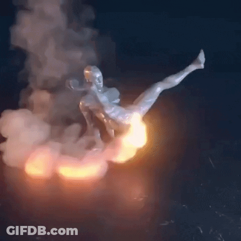 A Statue Of A Man Is Flying Through The Air With Smoke Coming Out Of It . GIF