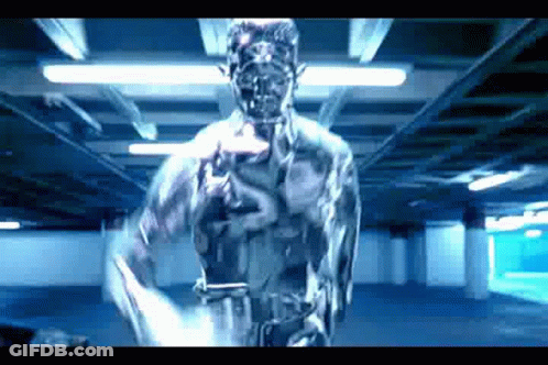 A Statue Of A Man Is Standing In A Dark Room With A Gun In His Hand . GIF