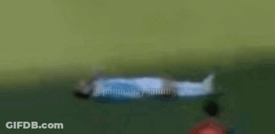 A Statue Of A Man Laying Down With The Word Monkey On The Bottom GIF