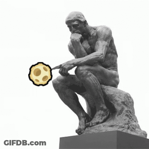A Statue Of A Man Sitting On A Rock With A Cookie Coming Out Of His Hand GIF