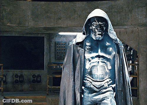 A Statue Of A Man Wearing A Hooded Cape And A Mask GIF