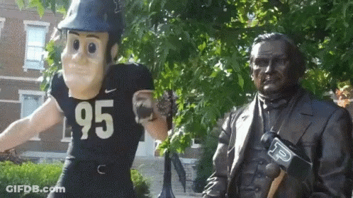 A Statue Of A Man Wearing A Number 95 Jersey GIF