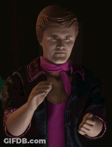 A Statue Of A Man Wearing A Pink Scarf And A Black Jacket GIF