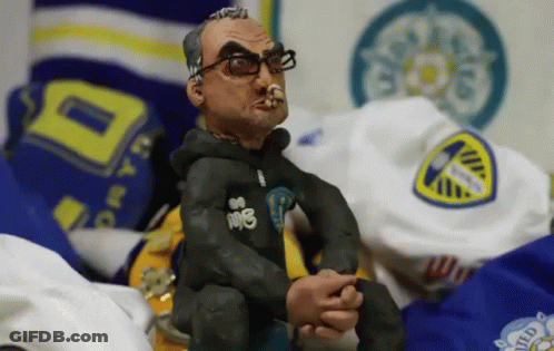 A Statue Of A Man Wearing Glasses And A Hoodie That Says 108 GIF