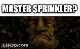 Bearded Man Statue With Master Sprinkler GIF