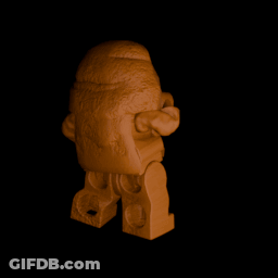 A Statue Of A Man With A Beard Is Standing In A Dark Room GIF