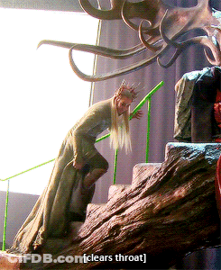 A Statue Of A Man With A Crown On His Head And The Words Clears Throat On The Bottom GIF