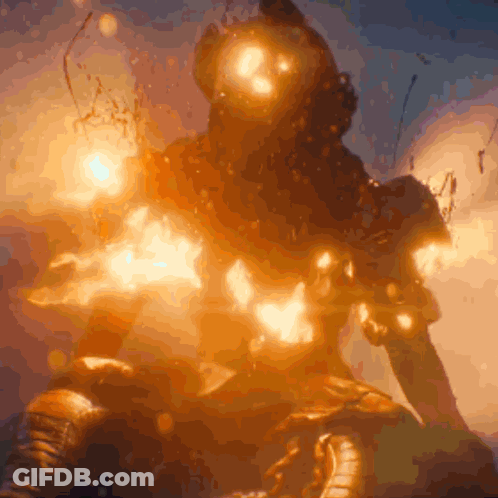 A Statue Of A Man With A Helmet On Is Surrounded By Flames GIF