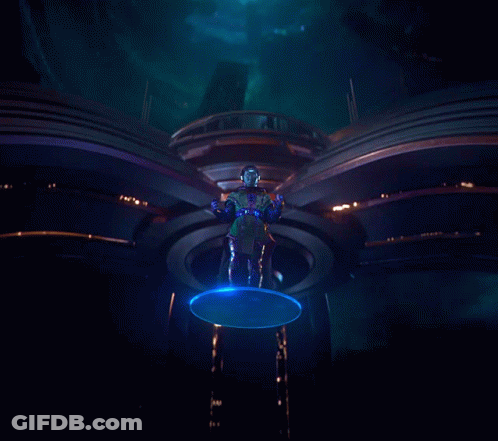 A Statue Of A Man With Blue Eyes Is Surrounded By Blue Lights GIF