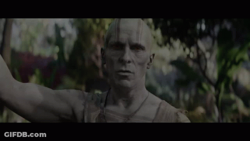 A Statue Of A Man With The Words All Gods Will Die Below It GIF