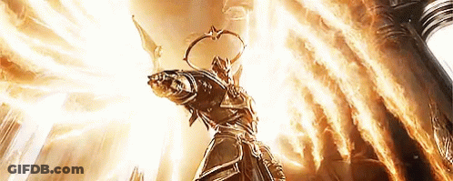 A Statue Of A Man With Wings Is Surrounded By Flames And Light GIF