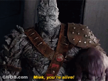 A Statue Of A Monster Says " Miek You 'Re Alive ! " GIF