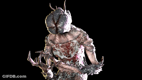 A Statue Of A Monster With A Huge Head GIF