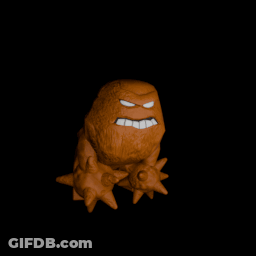 A Statue Of A Monster With Spikes On His Head GIF