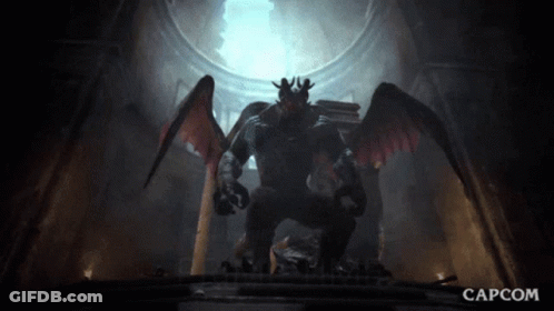 A Statue Of A Monster With Wings And The Capcom Logo GIF