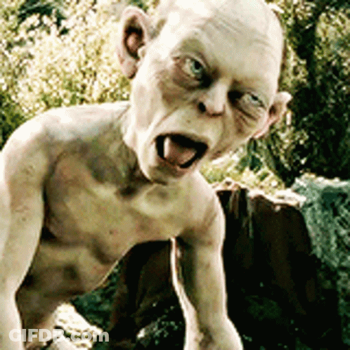 A Statue Of A Naked Man With His Tongue Out GIF