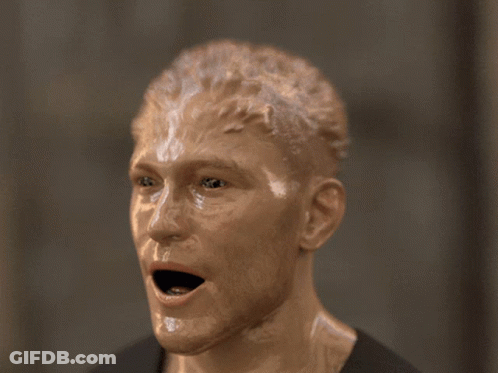 A Statue Of A Person 'S Head With A Hole In It GIF
