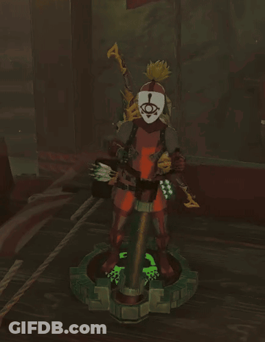 A Statue Of A Person With A Mask On Their Head GIF