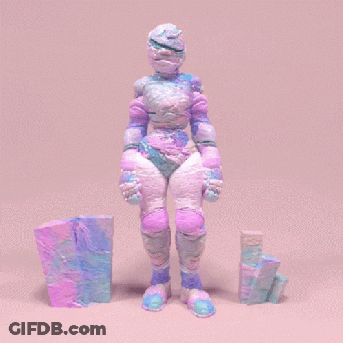 A Statue Of A Person With A Purple And Blue Costume GIF