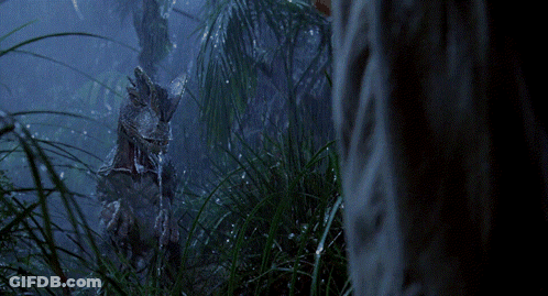 A Statue Of A Rabbit Is Standing In The Grass GIF