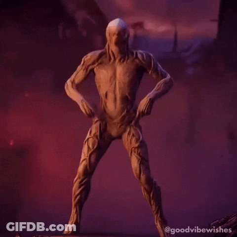 A Statue Of A Skeleton Making A Peace Sign With His Hands GIF