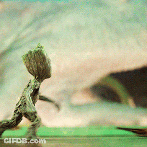 Tree Statue With Large Trunk On Head GIF